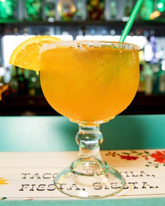 A mango margarita on the table