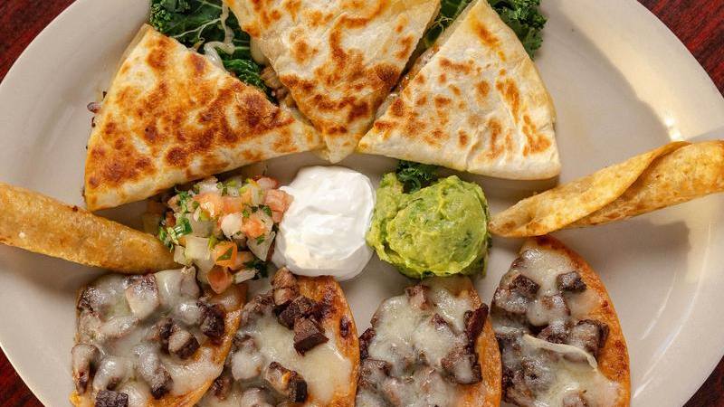 Vicky's Sampler: fajita quesadilla and beef fajita nachos with guacamole and sour cream