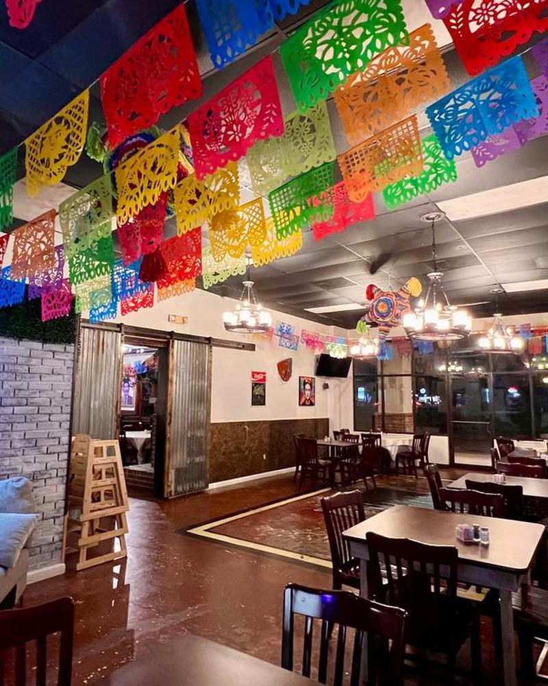 The dining room under rows of papel picado banners