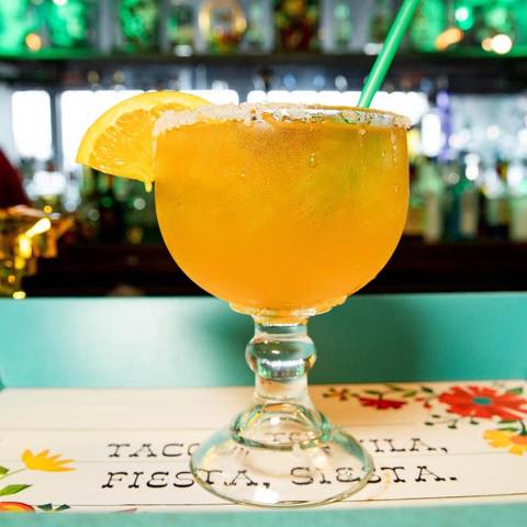 A mango margarita on the table