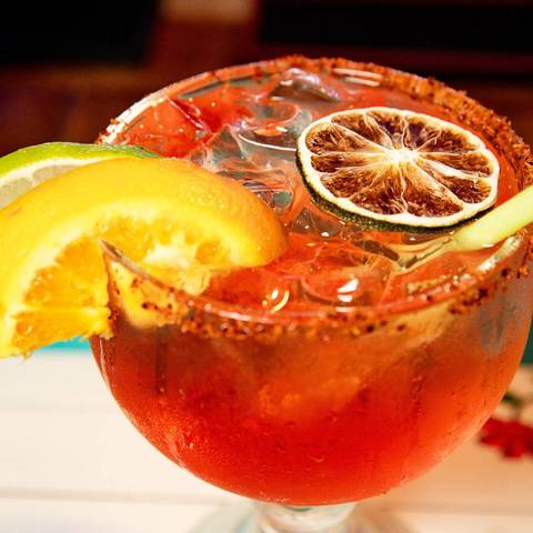 A sunset margarita with a chile rim