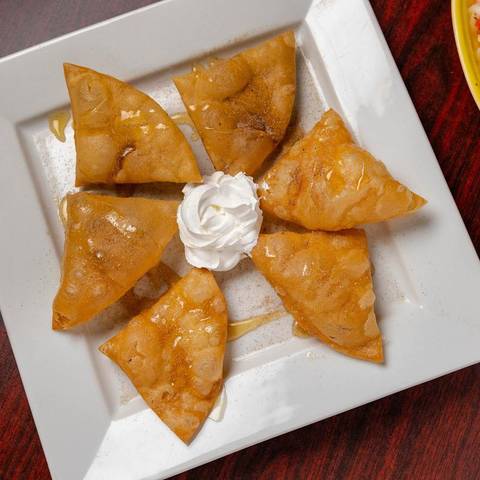 Sopapillas topped with whipped cream