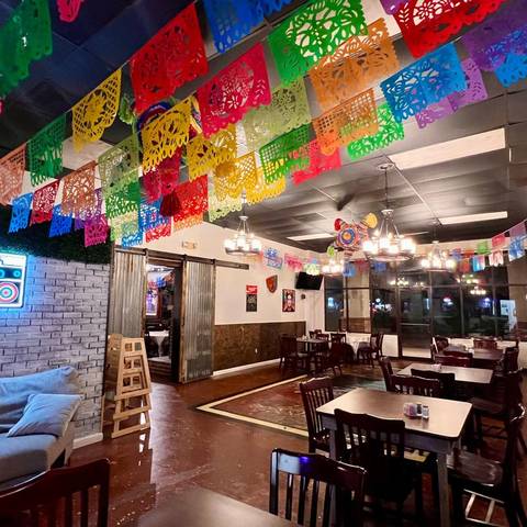 The dining room under rows of papel picado banners